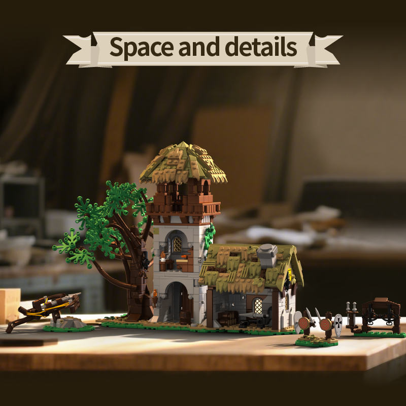 Small model village with buildings and trees on a wooden surface.