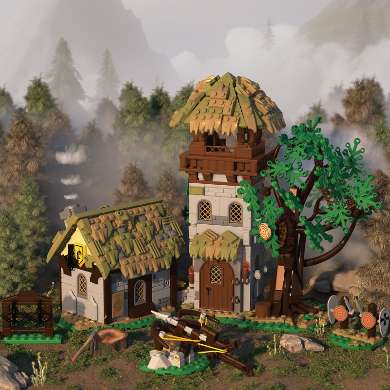 Toy model of a medieval village with houses and a tree in a forest setting
